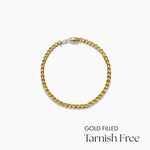 Gold filled bracelet on a white background with text 'Gold Filled Tarnish Free'.