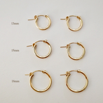 Set of 13mm, 15mm, and 18mm gold-filled hoop earrings displayed flat on white background.