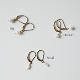 hree pairs of Olivia Pearl Earrings showcasing size variations in freshwater pearls