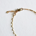 Detailed image of lobster clasp and extension links for adjustable fit