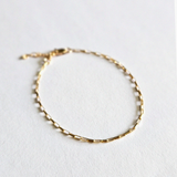Zoom-in on gold chain texture highlighting dainty finish"