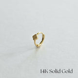 Side view of Lil Clover Huggie Hoop in 14K gold with crystal-studded clover charm