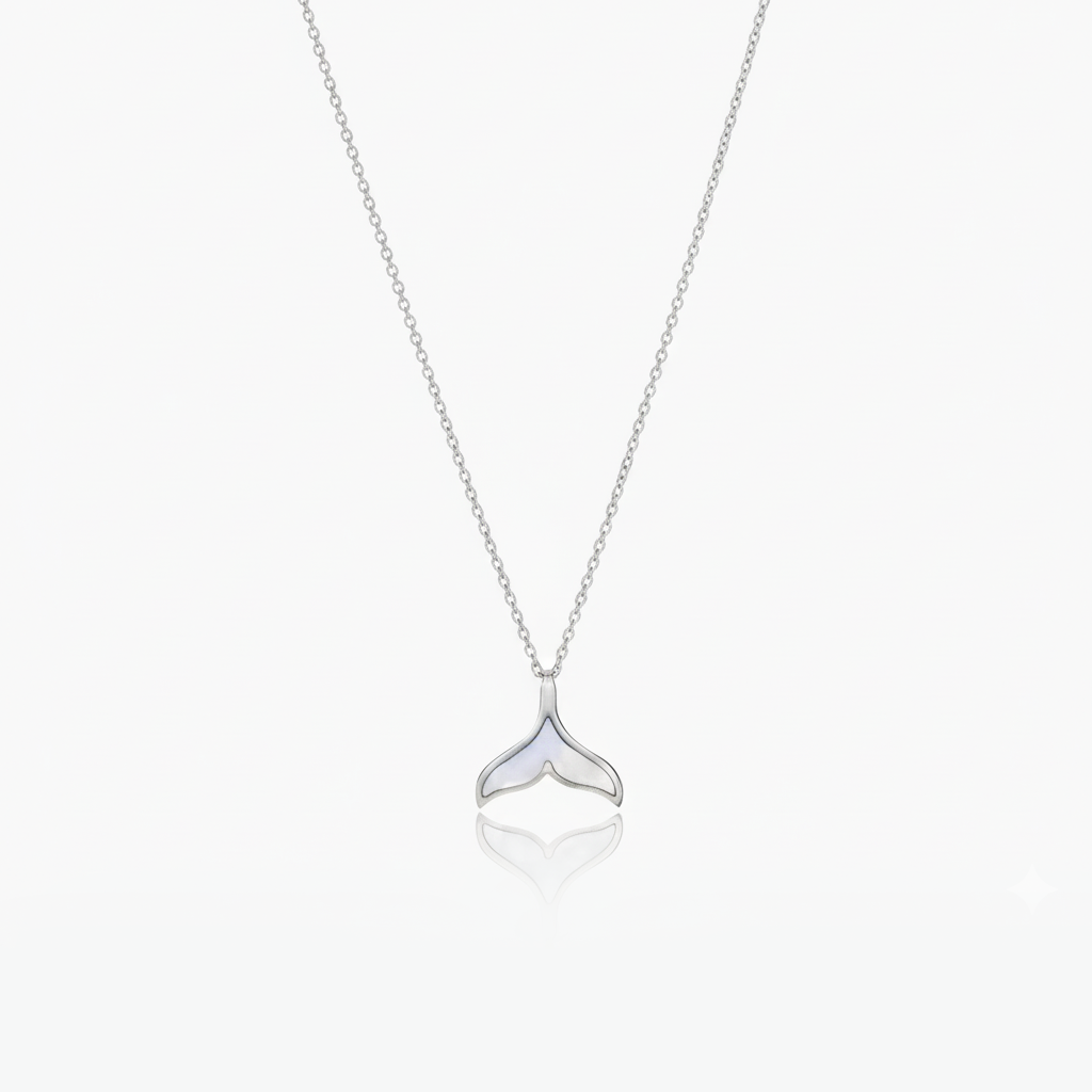 Silver whale tail necklace on a white background