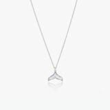 Silver whale tail necklace on a white background