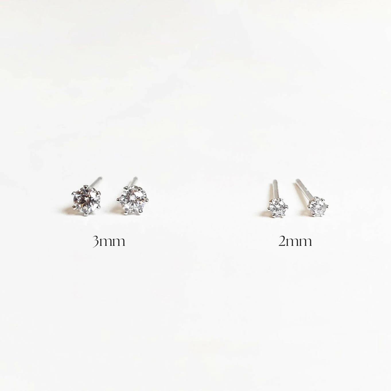 3mm and 2mm cubic zirconia studs pairs on the white background