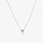 Silver necklace with a small round pendant on a white background