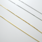 Gold and silver chains on a white background