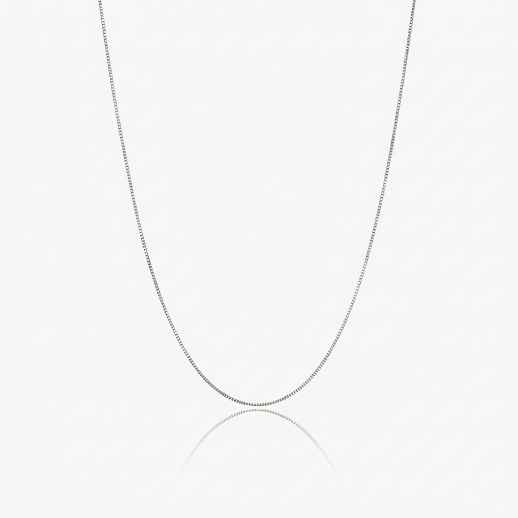 Silver box chain necklace on a white background
