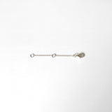 Sterling silver and gold chain extenders laid flat on white background with lobster clasps and O-rings visible