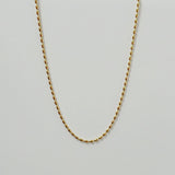 Close-up of Vienna Necklace’s pill-shaped chain design on a white background.