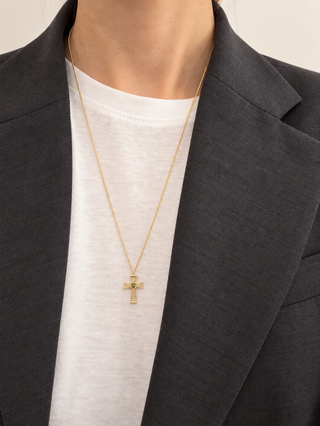 Eden Cross Necklace worn with a white top and charcoal blazer