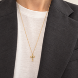 Eden Cross Necklace worn with a white top and charcoal blazer