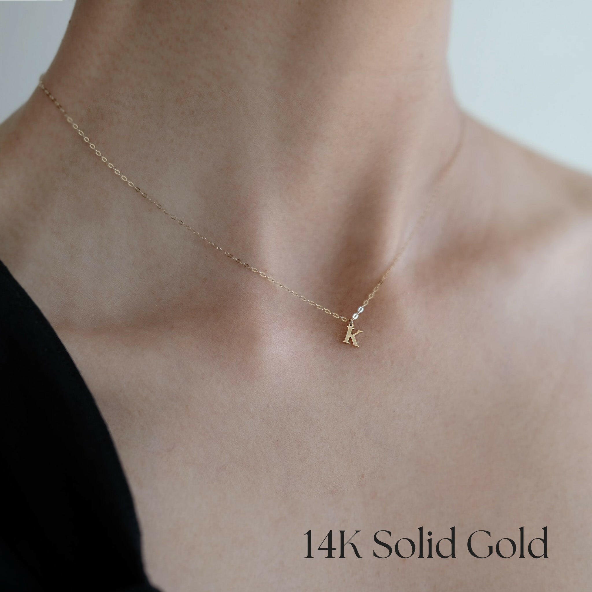 Model wearing 14K Classic Initial Necklace with pendant resting at collarbone