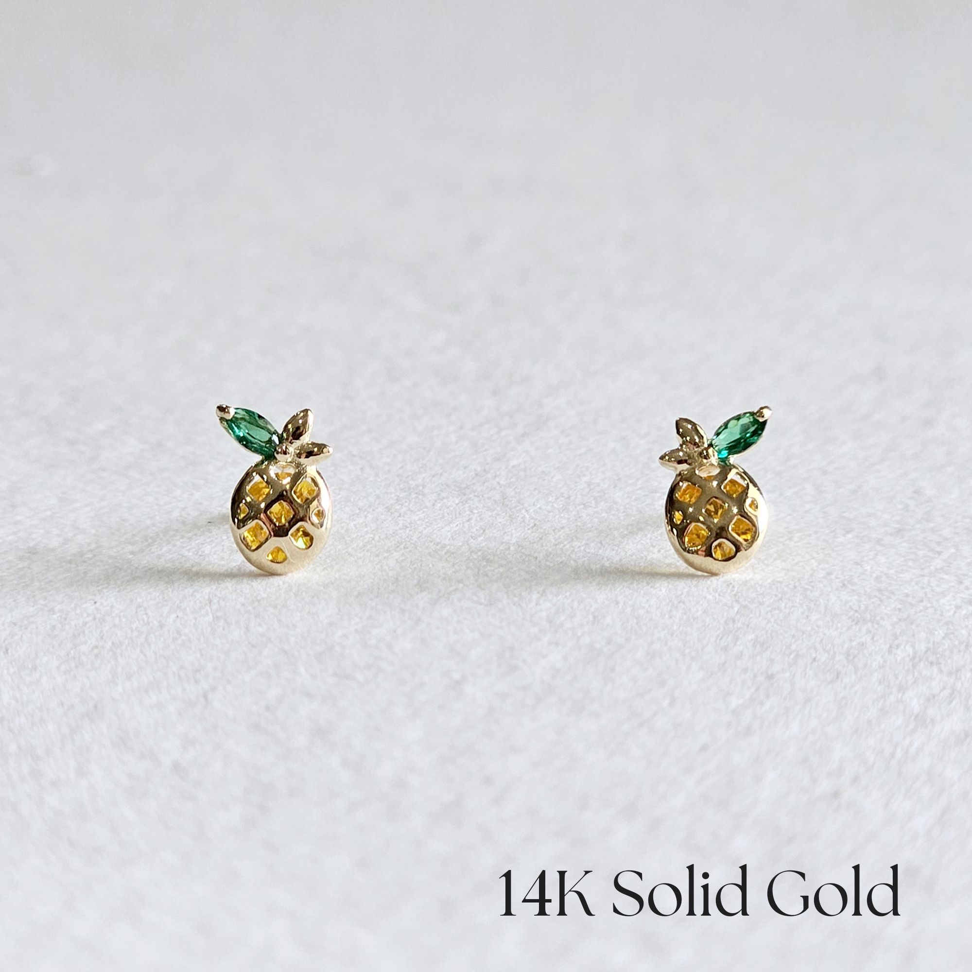Front view of Petite Pineapple gold earrings with colorful cubic stones