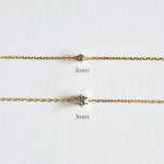 Two gold chains with diamond pendants on a white background, labeled '2mm' and '3mm'.