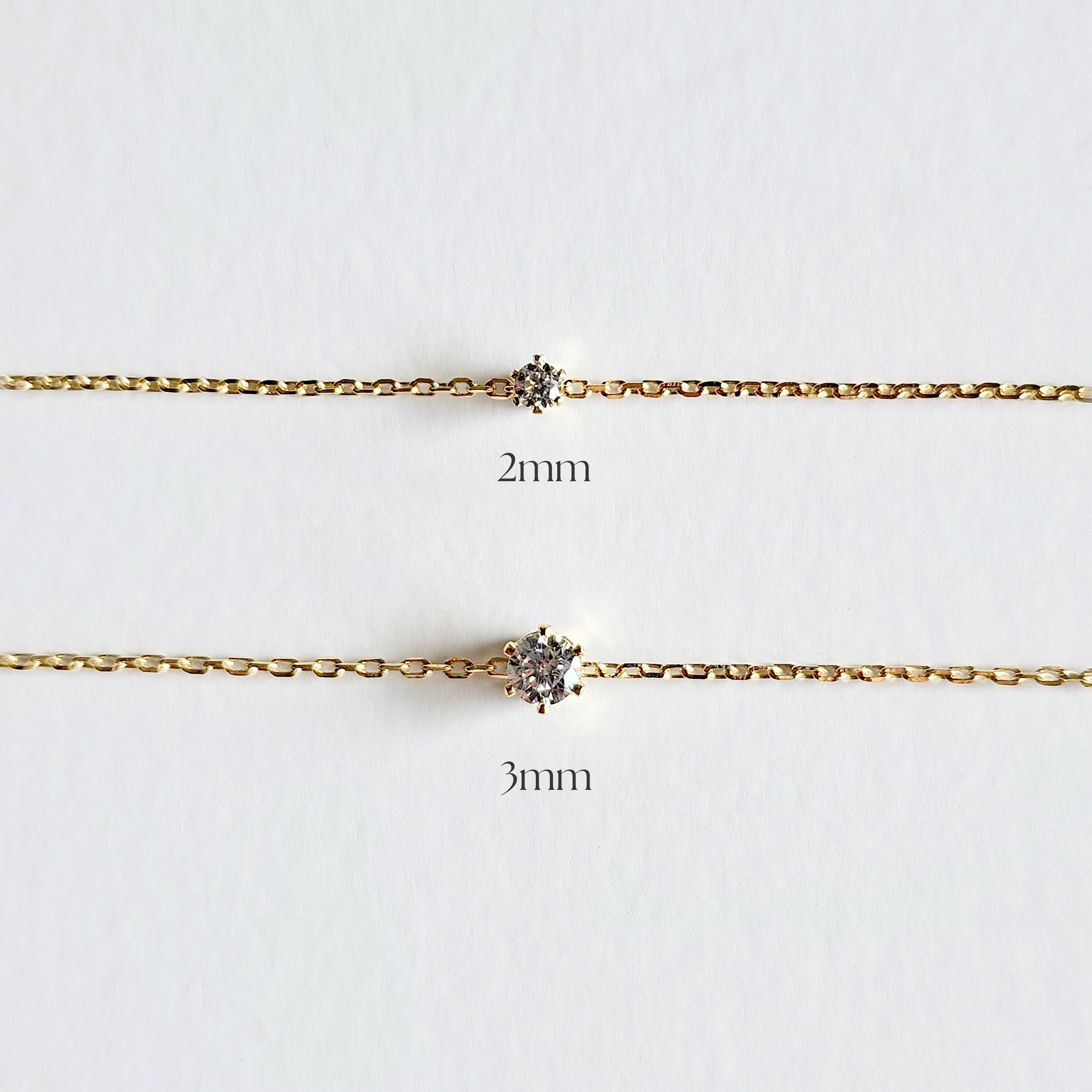 Two gold chains with diamond pendants on a white background, labeled '2mm' and '3mm'.