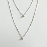 Petite Crystal Double Chain Necklace in silver displayed in a soft curve with double-layered chains