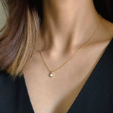 White opal version styled alone against the neckline