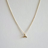 Dainty whale tail pendant with sleek chain, ocean charm jewelry inspired by marine life