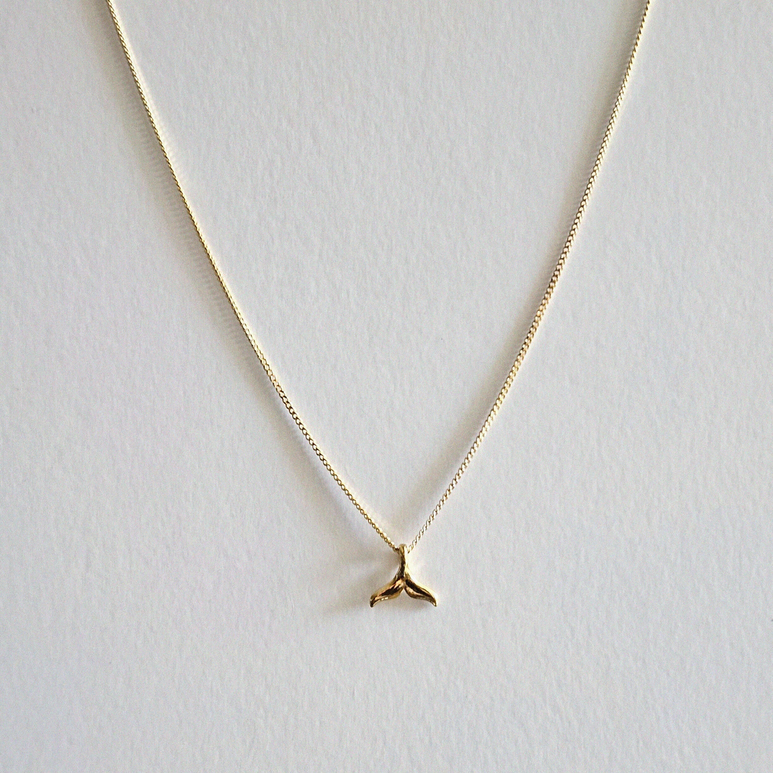 Dainty whale tail pendant with sleek chain, ocean charm jewelry inspired by marine life