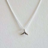 Dainty whale tail pendant with sleek chain, ocean charm jewelry inspired by marine life