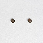 Front view of Bishop Circle Studs with centered CZ in 10K gold