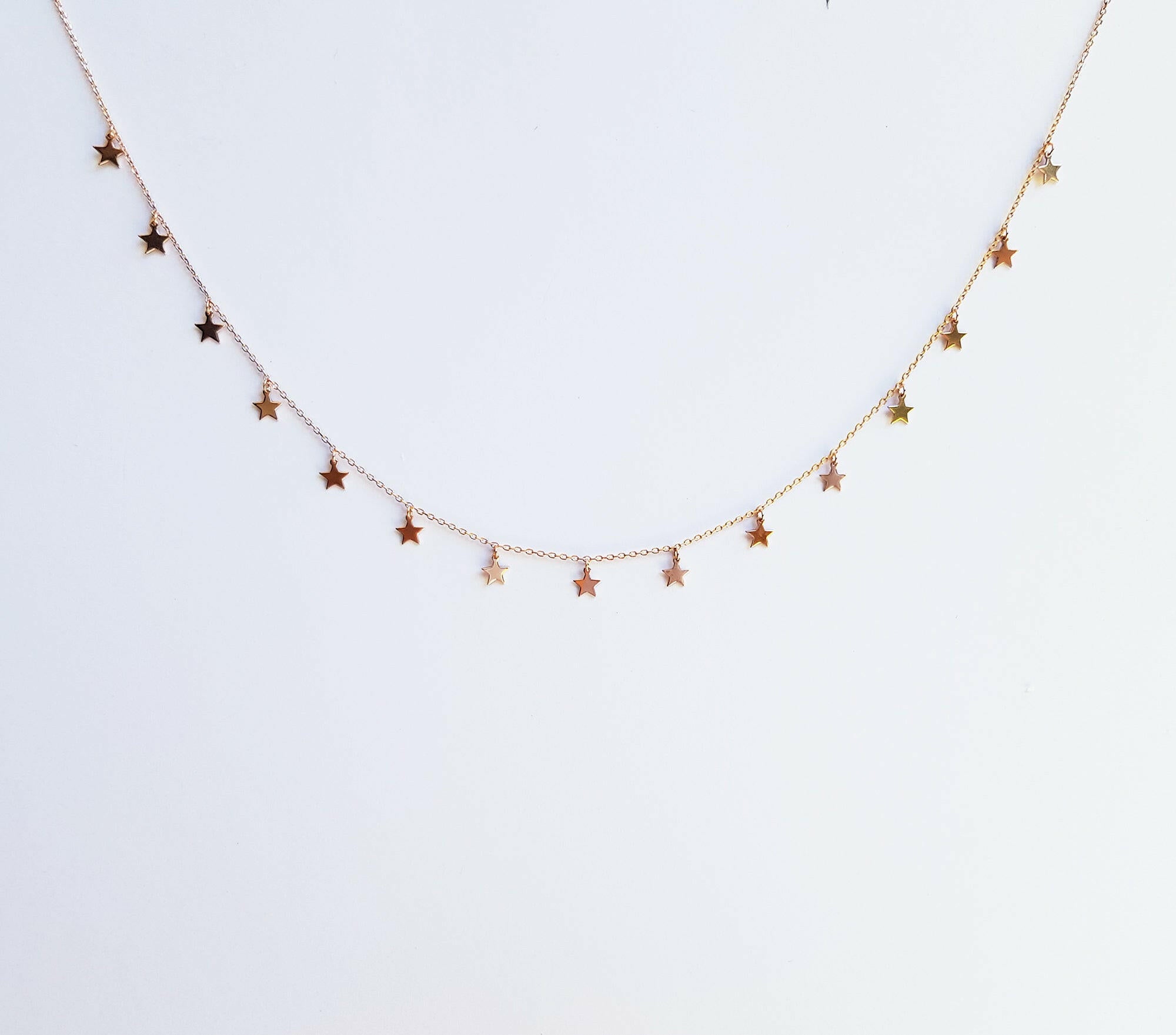 Dainty star charms necklace featuring delicate chain with shining stars, perfect elegant accessory