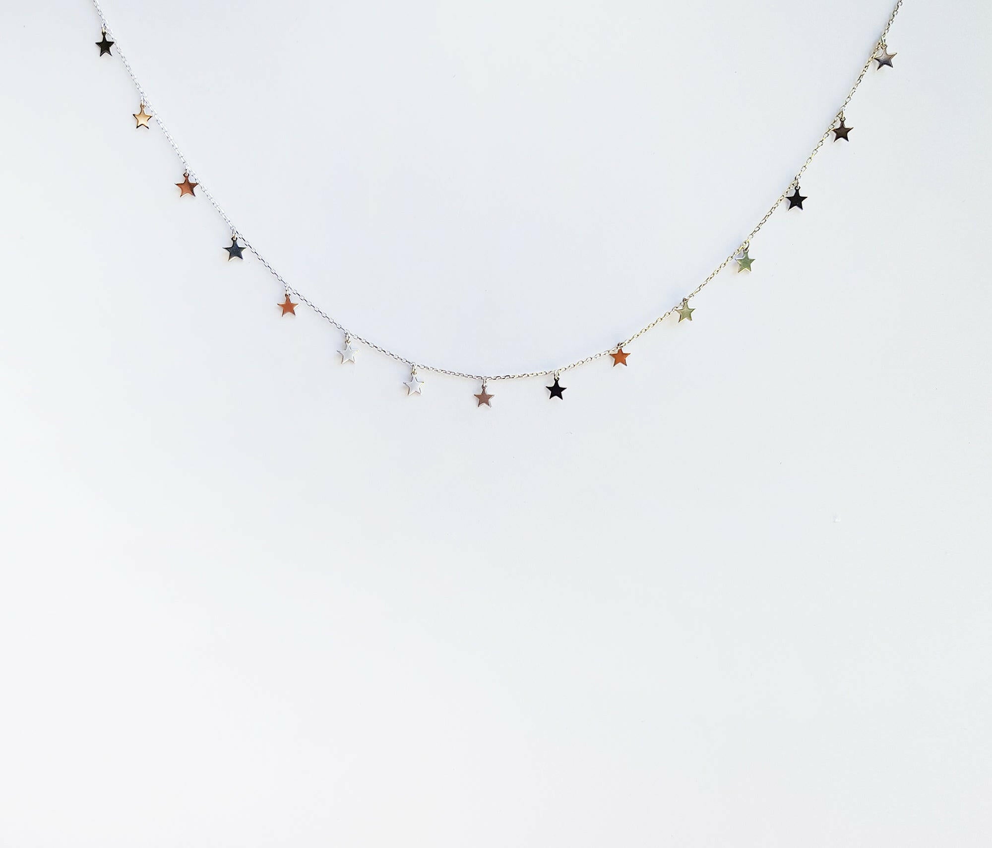 Dainty star charms necklace featuring delicate chain with shining stars, perfect elegant accessory
