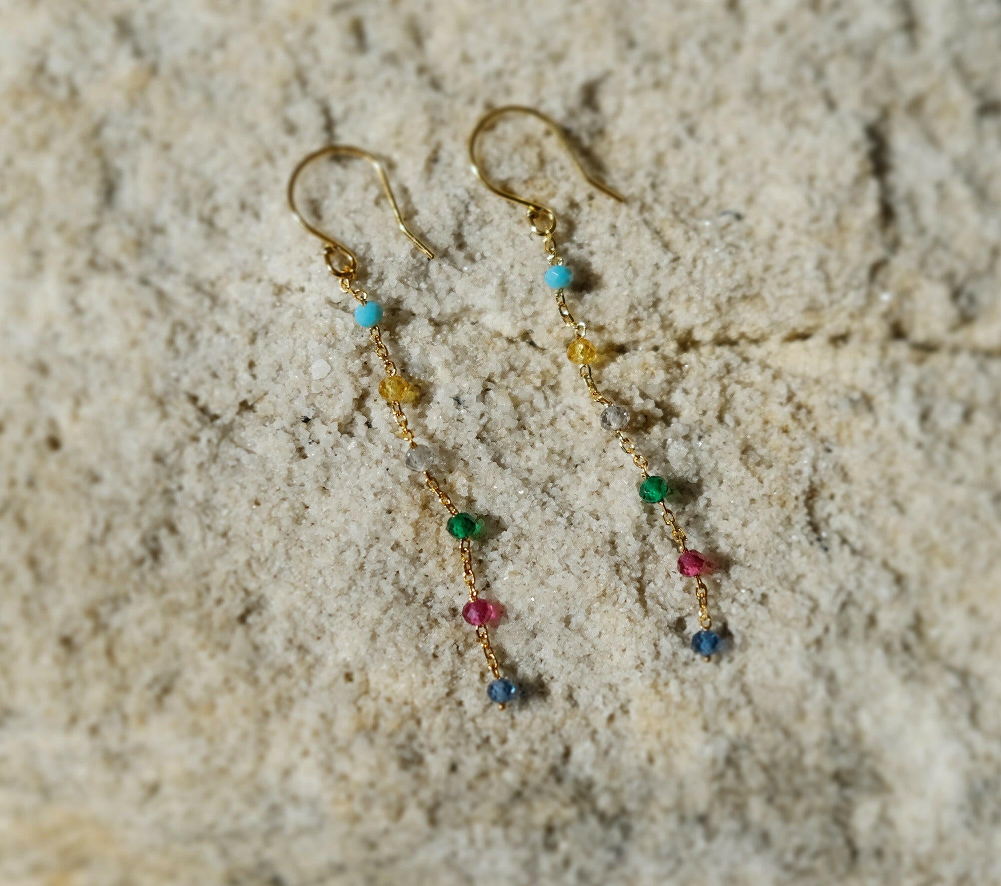 Rainbow hook earrings featuring colourful stones in an elegant chain drop style for vibrant, stylish accessories.