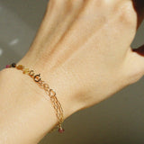 Side angle wrist shot showing clasp and colorful tourmaline stones