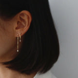 Model wearing Lydia Chain With Pearl Earrings, highlighting the elegant drop and pearl accents