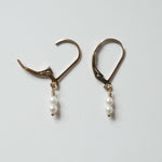 Close-up of Olivia Pearl Earring showing two of small pearl and smooth finish