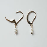 Close-up of Olivia Pearl Earring showing two of small pearl and smooth finish