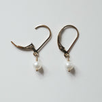 Close-up of Olivia Pearl Earring showing two of mideum pearl and smooth finish