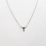 Necklace with a letter 'T' pendant on a white background